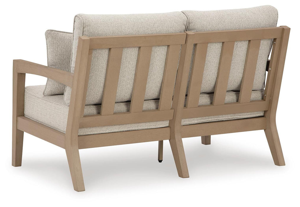 Hallow Creek Outdoor Loveseat with Cushion - CasaBella Furniture (San Antonio, TX)