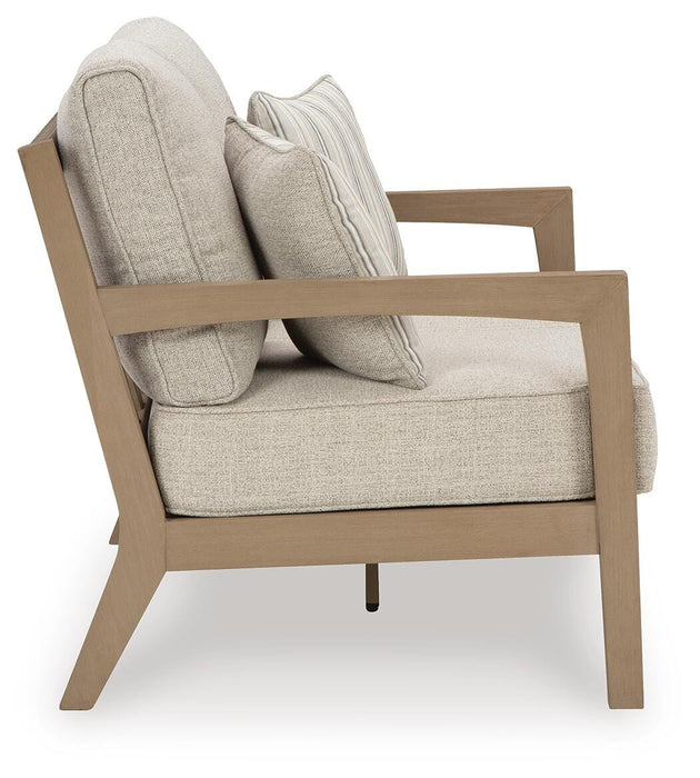 Hallow Creek Outdoor Loveseat with Cushion - CasaBella Furniture (San Antonio, TX)